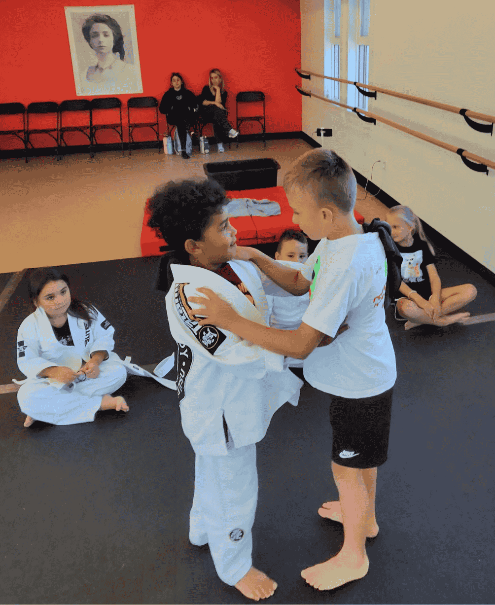 Kids practicing jiu-jitsu after school